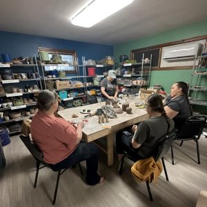 Studio members working individually